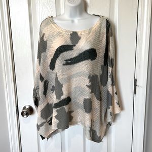 Oversized thin camo top. Runs large.